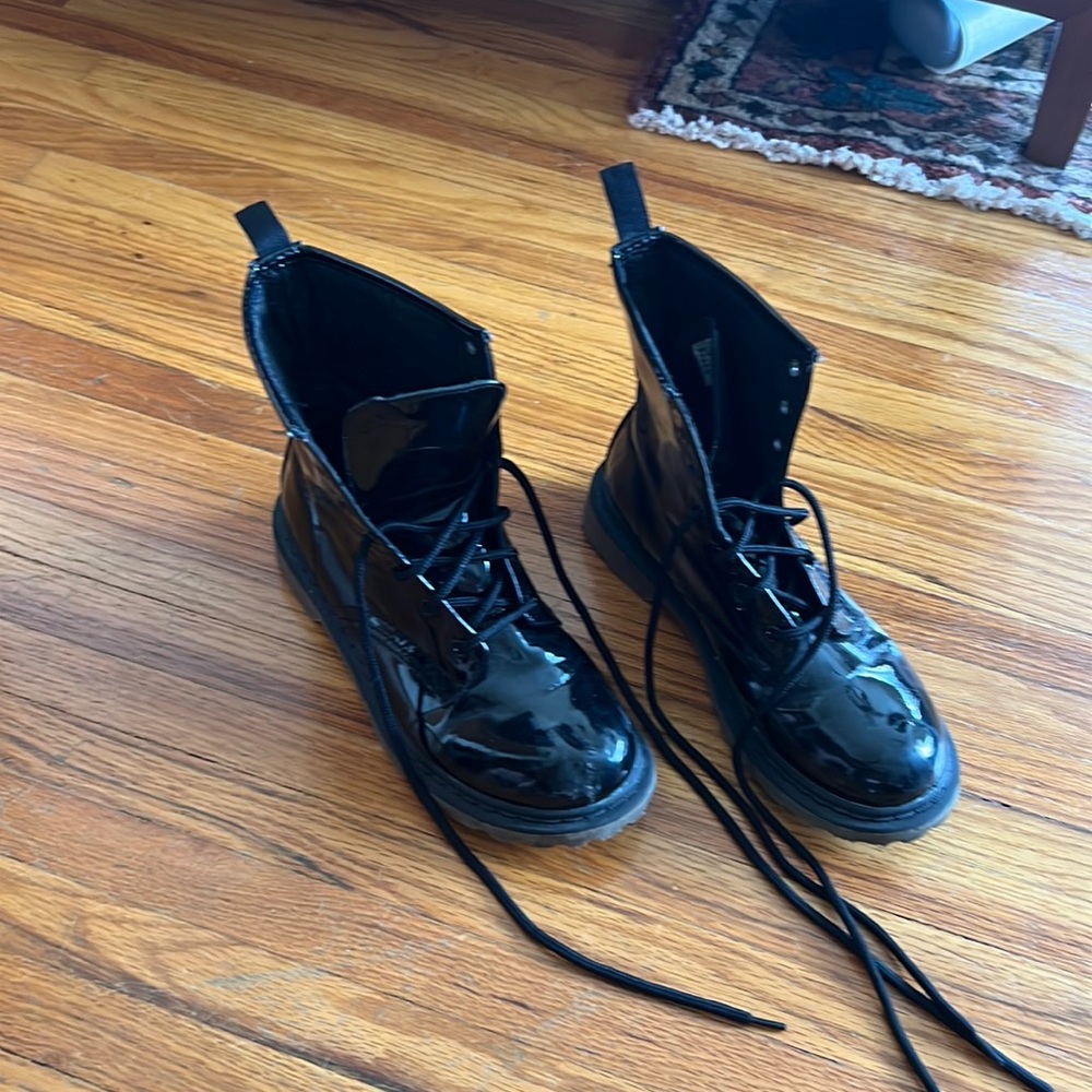 Black combat boots with a shine